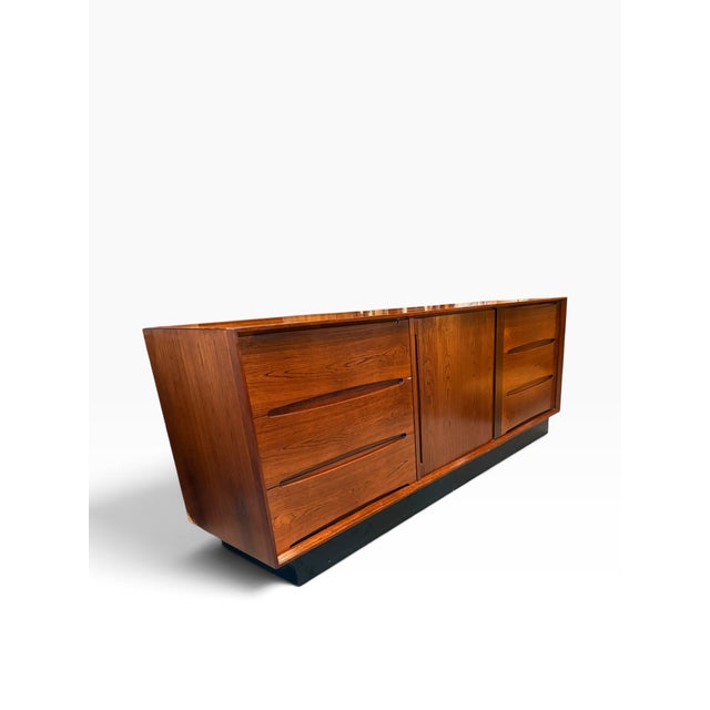 An exceptional vintage Danish Modern dresser or sideboard by Dyrlund, Denmark, showcasing the refined craftsmanship and...