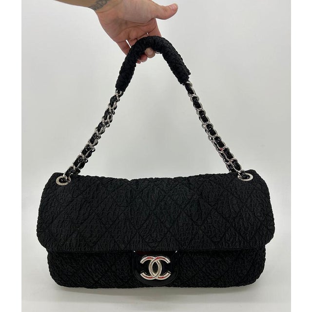 RARE Chanel Black Cloquèe XL Classic Flap in good condition. Black textured nylon in quilted diamond pattern trimmed with...