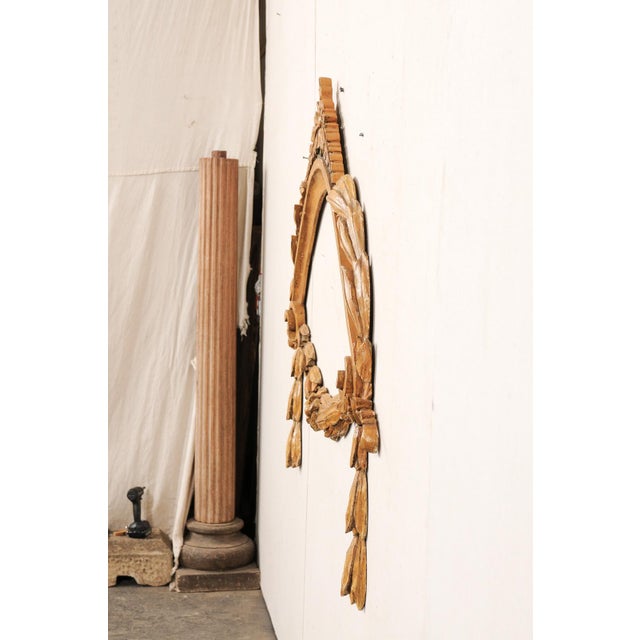 An Italian large sized and skillfully carved "swag" wall decoration from the late 19th century. This beautiful antique...