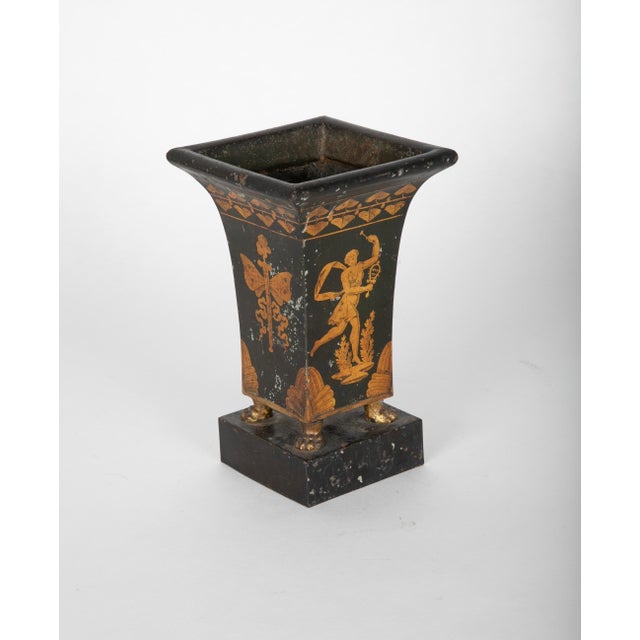 A very charming early 19th century French tole peinte vase or urn with a gilt figure of a dancing maiden with one breast...