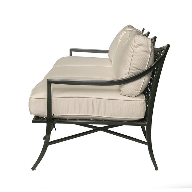 The Haret Outdoor Sofa features distinctive signature fretwork detailing across the seat, and back accents, giving it a...