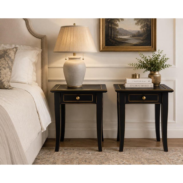 A striking pair of vintage solid wood accent tables refinished in a dramatic Onyx Black finish with hand-applied gilded...