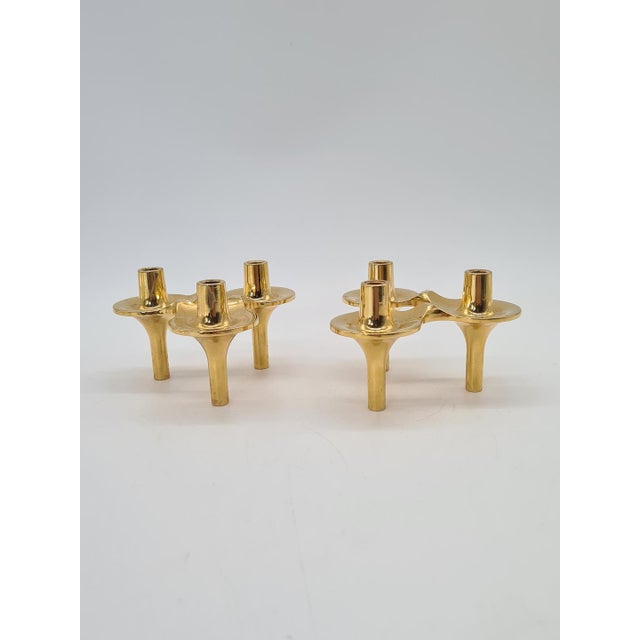A set of two bmf orion modular candlesticks, made of solid brass in denmark in the 1970s. the orion model is one of the...