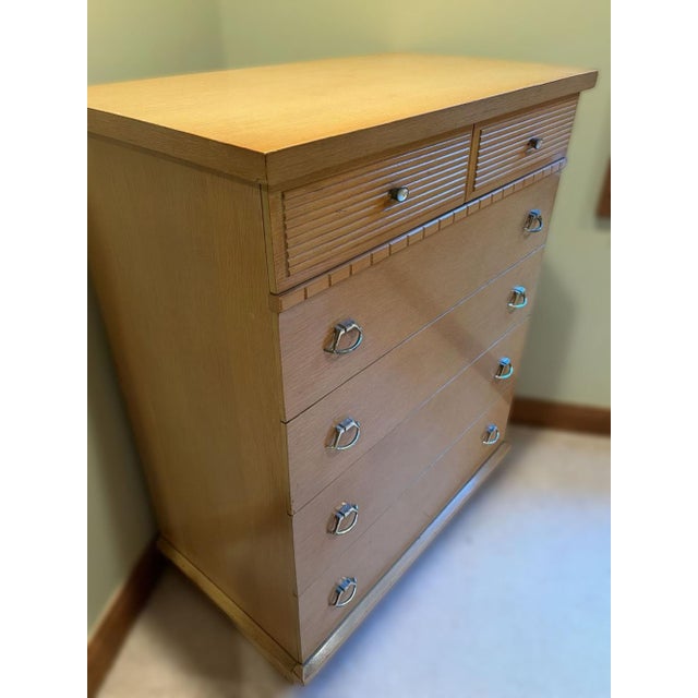 This vintage Mid-Century Modern tallboy chest of drawers from Hooker Furniture's sought-after "Mainline" collection...