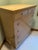 This vintage Mid-Century Modern tallboy chest of drawers from Hooker Furniture's sought-after "Mainline" collection...
