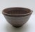 Japanese medium-size turned stoneware mortar bowl with a spout and combed and fluted interior texture. It has been...