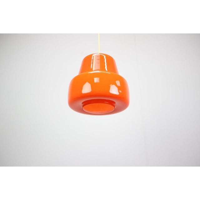 Exceptional vintage pendant lamp from Czechoslovakia, dating from around 1970. The sculptural shade is formed from glossy...