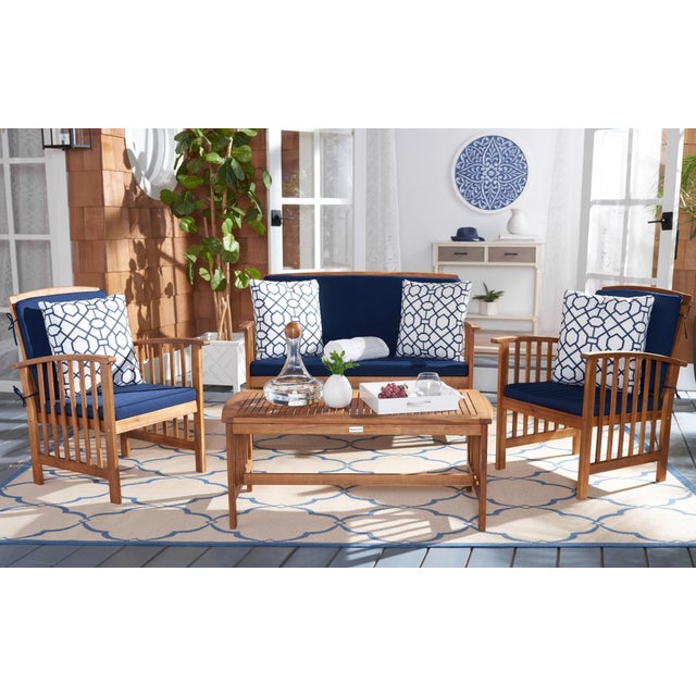 The open and airy design of the Rocklin 4 Piece Outdoor Set beautifully combines form and function. Its slatted silhouette...
