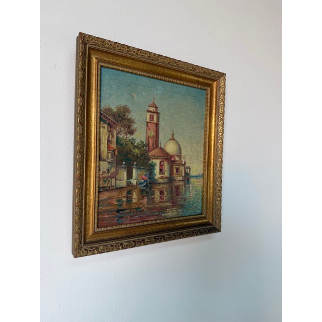 Charming 1950’s vintage oil on canvas painting by B. Hensel depicting a picturesque European canal landscape in an...