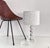 A sculptural table lamp in the postmodernist style of the 1970s, Made in Italy. The lamp features a body made of thick,...