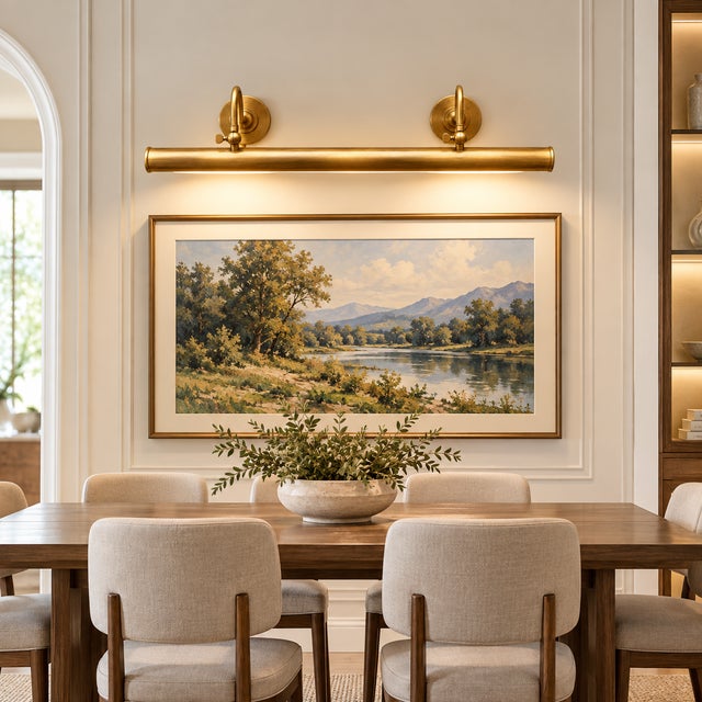 Designed to bring focused illumination to artwork, this handcrafted brass picture light features an elongated cylindrical...