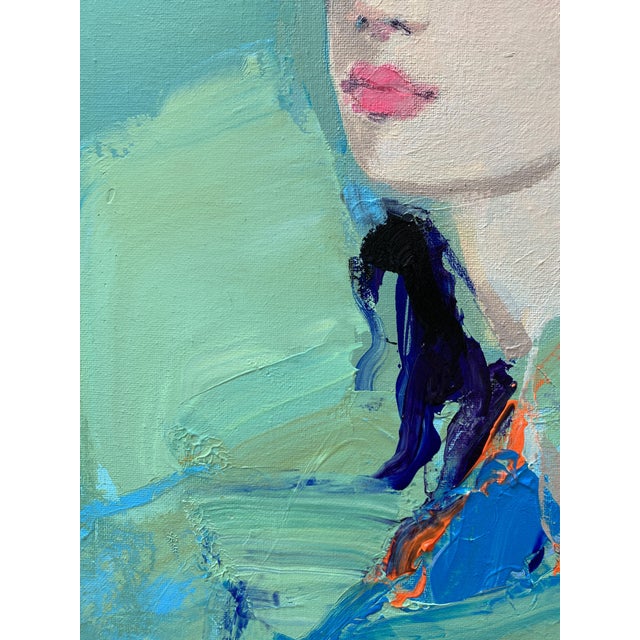 The Weight of Blue shows a woman balanced between stillness and movement. The figure remains still, while the open,...