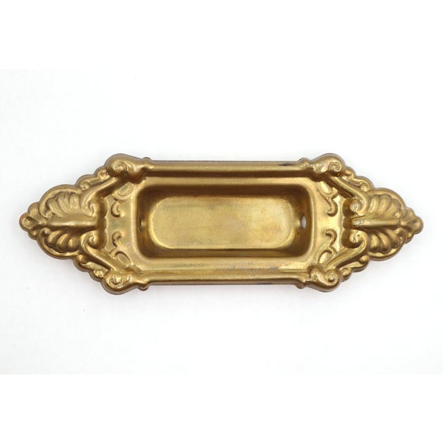 Victorian style reproduction window sash lift made of pressed brass with an antique finish. The original mounting screws...