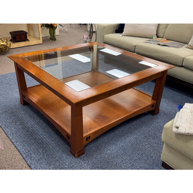 A handsome Stickley coffee table showcasing the timeless appeal of American Mission-style craftsmanship. Featuring a rich,...