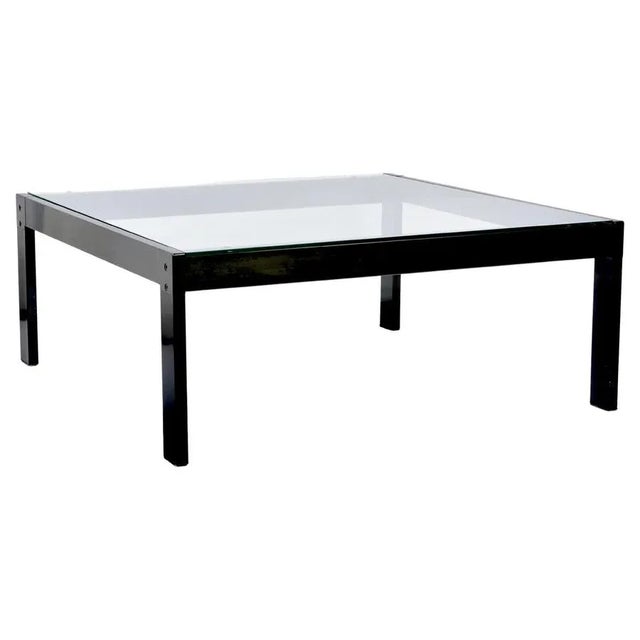 Amazing midcentury glass and enamelled black metal coffee table. This fantastic piece was designed in Italy by Gae Aulenti...