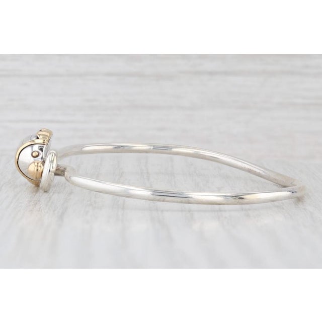 This scarab bracelet comes with a classic Tiffany blue box and pouch. Metal: Sterling Silver, 18k Yellow Gold Weight: 13.1...
