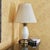Elegant vintage Ethan Allen table lamp featuring an ivory/cream glazed porcelain body with a subtle embossed leaf motif,...