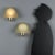 Two wall lamps crafted from brass and Murano glass, VeArt manufacture from the 1980s. The brass structure adds a touch of...