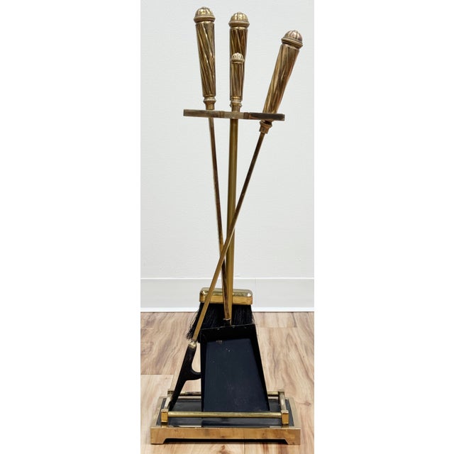 Vintage three (3) piece fireplace tool set on stand. Sturdy black cast iron base with brass trim. Each tool handle is...