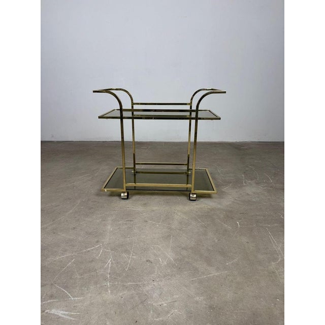 Brass Serving Trolley - 1970s Serving trolley dating to the 1970s The structure is made of brass, a material frequently...