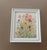 A joyful burst of color, this framed piece captures the carefree beauty of wildflowers in full bloom. With pink...