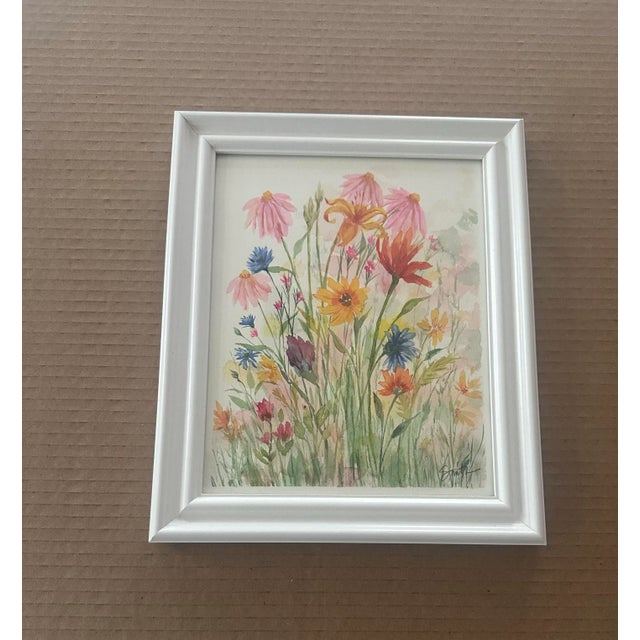 A joyful burst of color, this framed piece captures the carefree beauty of wildflowers in full bloom. With pink...