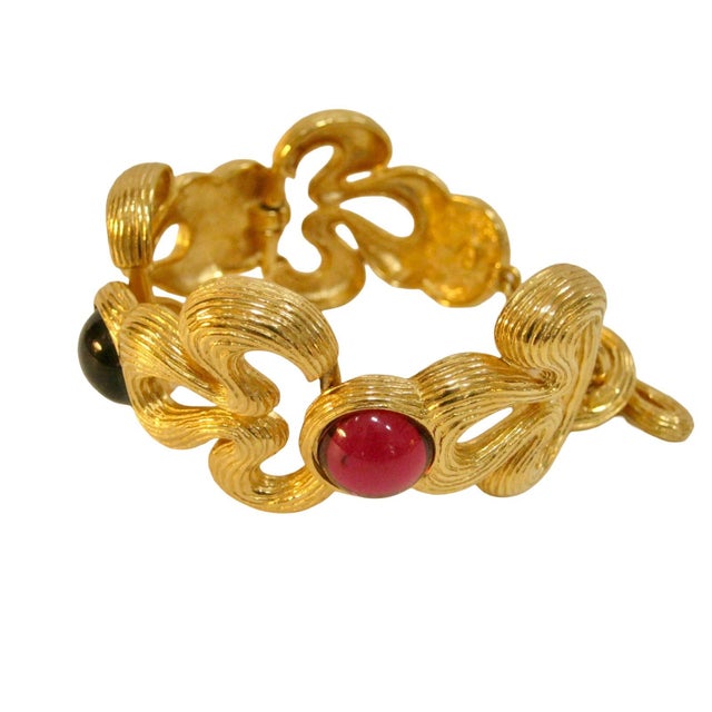 1980s Givenchy carved gold plated gripoix midnight blue & ruby red cabochon toggle link bracelet 8"L, 1.25W Signed,...