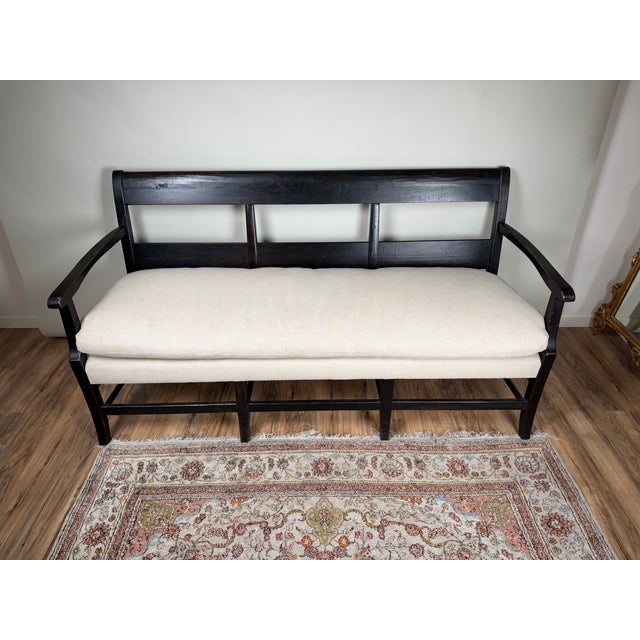 This substantial antique English three-seat bench dates to the late 19th century and has the straightforward, sturdy...