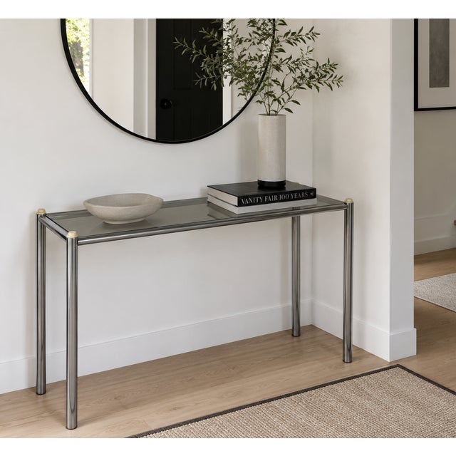 Mid Century Modern Chrome & Smoked Glass Console Table, c. 1960's. This simple and sleek table is perfect for placing...