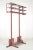 Mid 20th century coat rack made of steel with a dark pink painted finish. Made by Gingher MFG. Co. in Scranton, PA. It is...