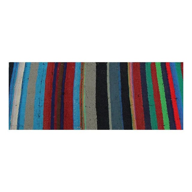 This beautifully simple rug is a traditional flatweave Scandinavian Style Kilim tribal rug featuring a vibrant multi-...