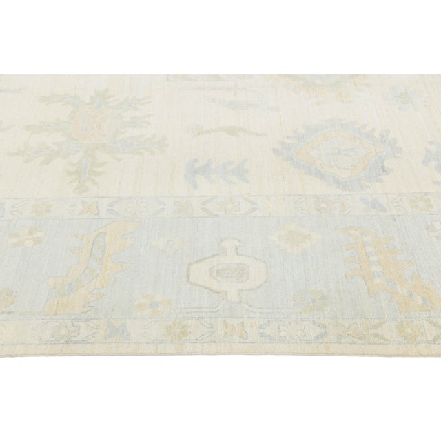 Artisanal Oushak Style Wool Area Rug: Neutral Ivory With Muted Floral Motifs For Sale - Image 10 of 11