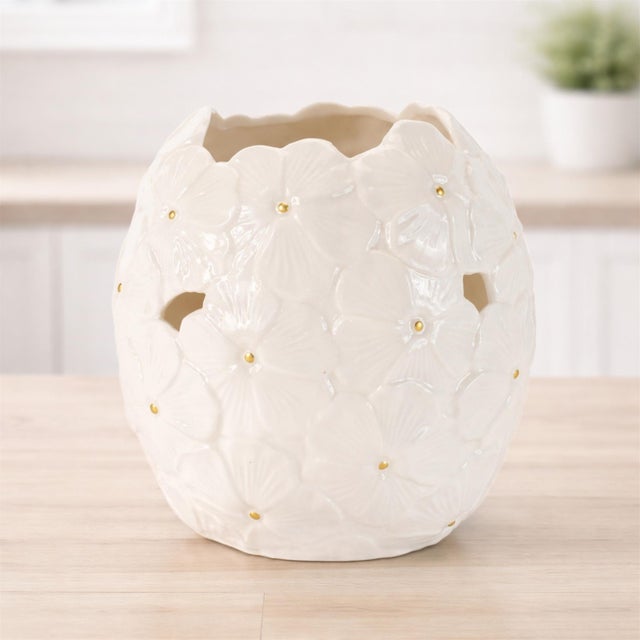 Delicate, elegant, and effortlessly chic, this White Floral Embossed Ceramic Vase Set brings timeless beauty to your home...