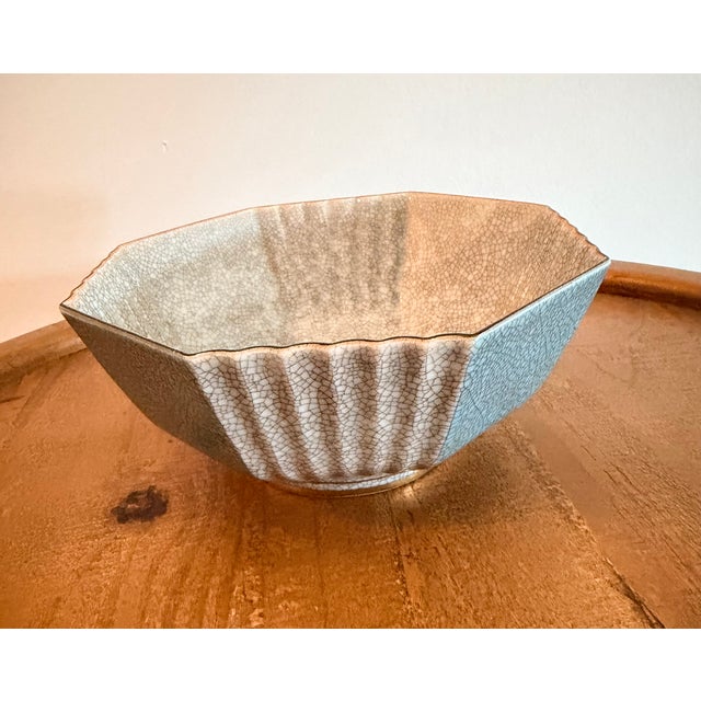 Coordinating Royal Copenhagen vase and faceted bowl featuring a delicate gray crackle glaze. The vase has a wide, flared...