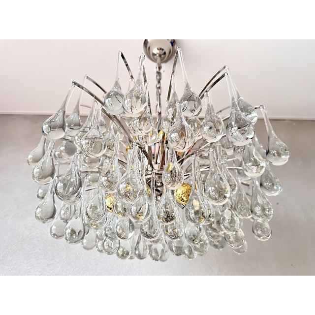 Beautiful mid-century design. Large 1970s chandelier made by the German company Christoph Palme. Chrome base with...
