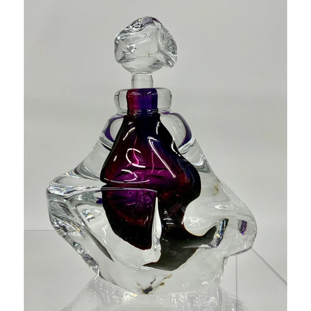 Look stunning from every angle! 1990s vintage hand blown free form purple and clear glass parfume bottle and stopper by...