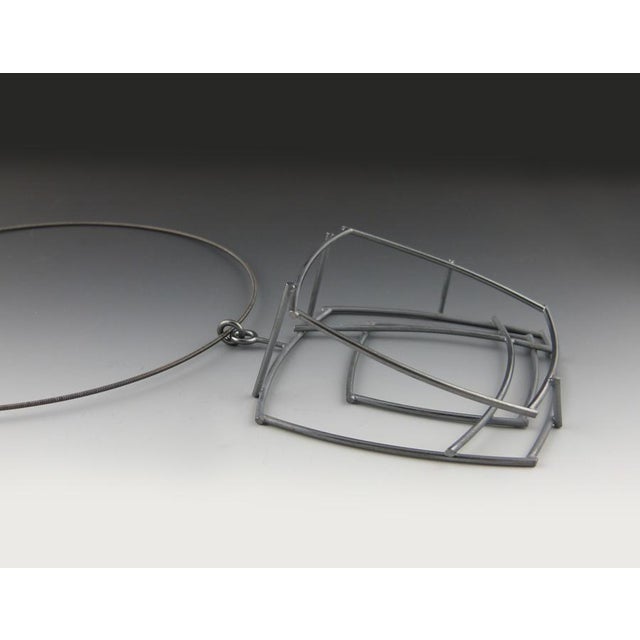 This large, three-dimensional square pendant was hand fabricated by noted American jewelry artist Donna D'Aquino in...