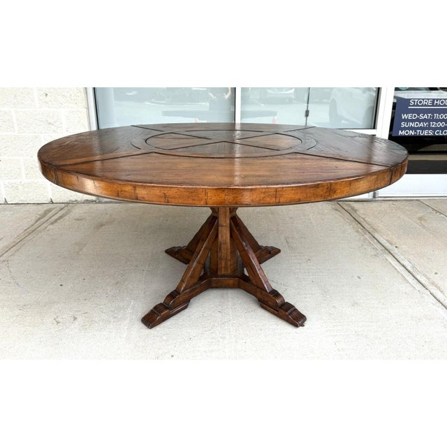This impressive 60″ round dining table by Jonathan Charles features a richly distressed Country Farmhouse Walnut finish,...