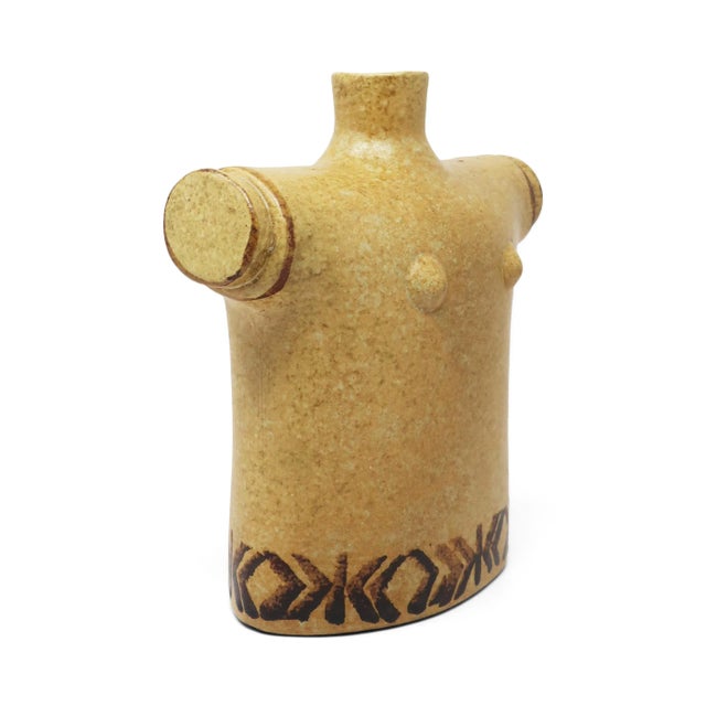 A fantastic pottery vase in the form of a female torso with a light tan textured glaze and dark brown decoration. Perfect...