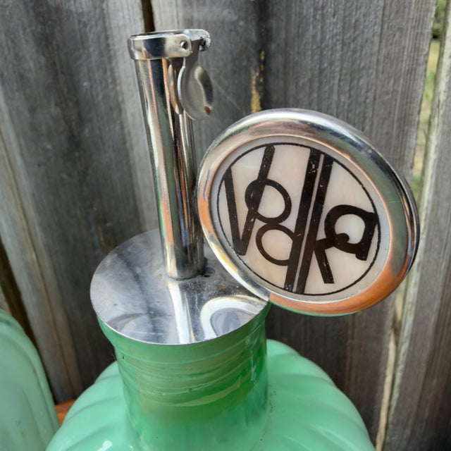 Up for sale is a beautiful matching trio of antique green glass liquor decanter bottles, perfect for a vintage home bar,...