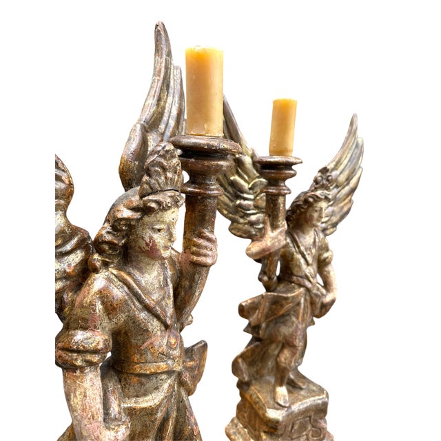 Pair of 18th Century Italian Carved and Polychrome Angel Candlesticks Pair of Baroque style winged angel candle sticks....