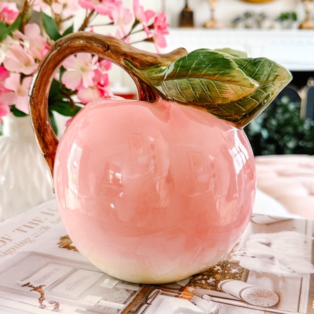 Bring a touch of sun-drenched warmth and whimsical charm to your table with this vintage Majolica style ceramic pitcher in...