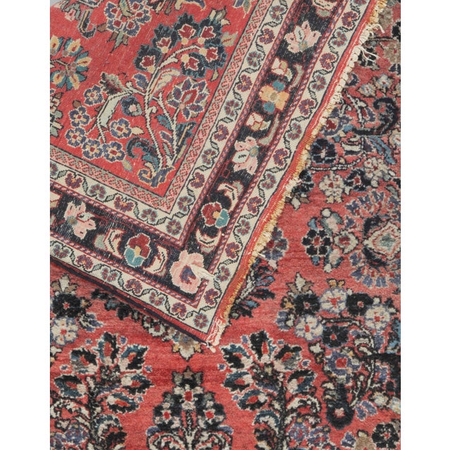 This piece features a central floral medallion, beautifully surrounded by intricate botanical motifs. It is framed by...