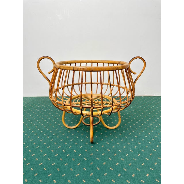 Lifted basket with handles in bamboo and rattan made in Italy in the 1960s.