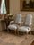 A pair of custom built French country chairs with a floral pattern from Design Center of the Americas (DCOTA). The fabric...