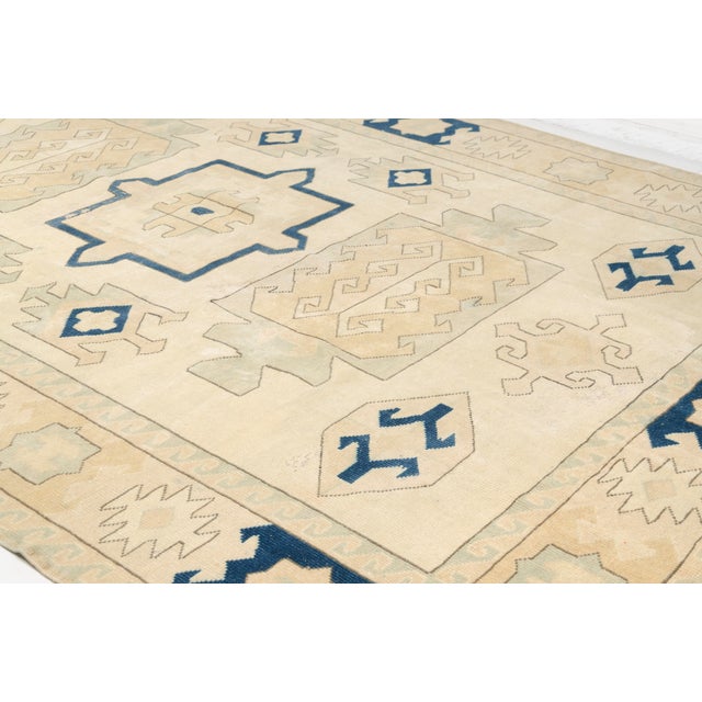 Enhance your home with this charming vintage Turkish rug, featuring a clean geometric design that brings a balanced and...