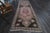 Vintage Hand-Knotted runner rug is a semi-antique vintage runner rug. The '70s Eastern region of Anatolia's unique rug is...