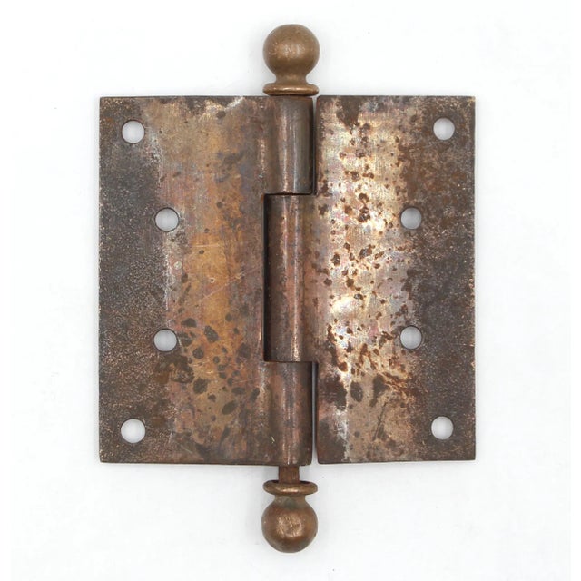 This Aesthetic style butt door hinge is made of brass plated steel with brass ball tips, three knuckles, and a template...