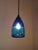 Intensely vibrant colors in blue and turquoise, with its distinctive Italian design, make this small Murano ceiling lamp a...