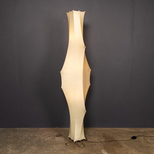 A 20th century rare vintage italian floor lamp from the 1960s, designed by tobia scarpa for flos. Constructed with a steel...